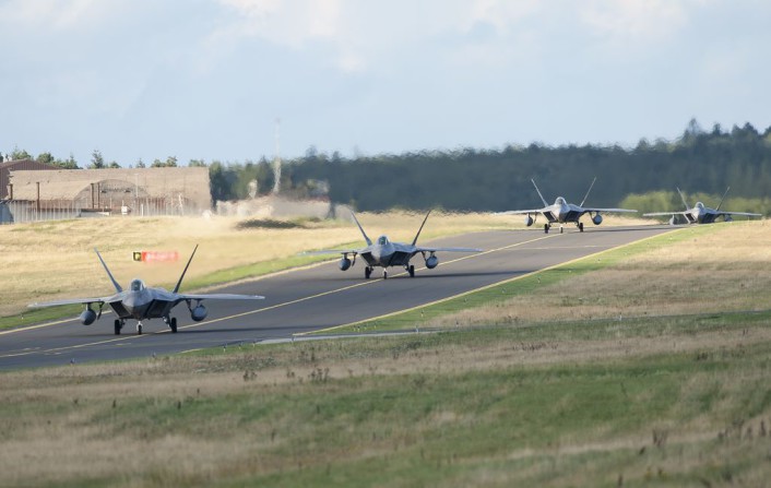 Four F-22 Raptor fighter aircraft taxi after landing at Spangdahlem Air Base, Germany, Aug. 28, 2015, as part of the inaugural F-22 training deployment to Europe. The F-22s are deployed from the 95th Fighter Squadron at Tyndall Air Force Base, Fla., as part of the European Reassurance Initiative and will conduct air training with other Europe-based aircraft while demonstrating U.S. commitment to NATO allies and the security of Europe. (U.S. Air Force photo by Staff Sgt. Chad Warren/Released)