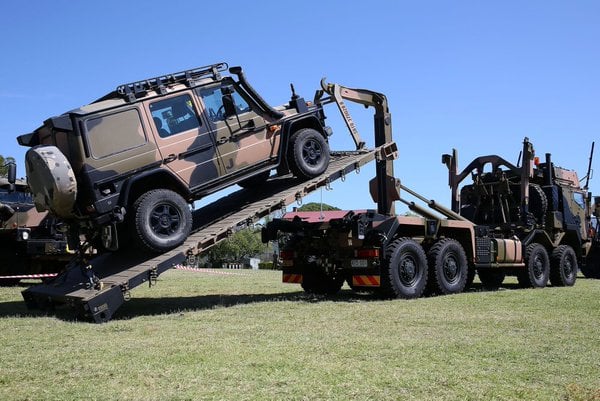 A Rheinmetall MAN truck on display with a Mercedes G-wagon during the handover ceremony. Credit:  David Allen