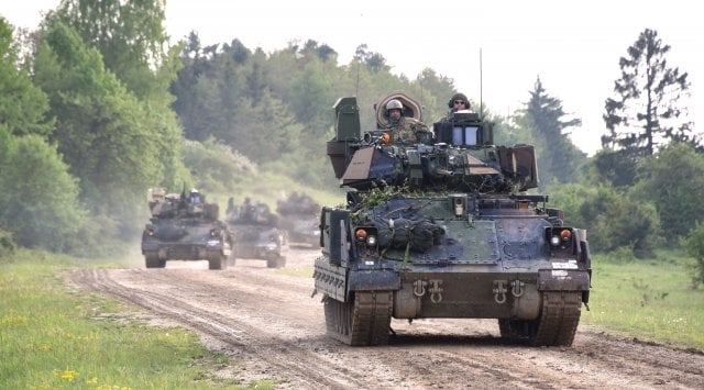 M2A3 Bradley Fighting Vehicles road march back to their tactical assemble area after a situational training exercise lane as a part of Combined Resolve VI at Hohenfels, Germany, May 16. Combined Resolve VI is a squadron-level decisive action rotation...