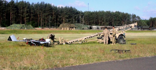 Soldiers from the 10th Engineer Battalion prepare a Shadow unmanned aircraft system for launch at Drawsko Pomorskie Training Area, Poland June 10 in support of Exercise Anakonda 16. The Soldiers made history, becoming the first U.S. military unit to fly a Shadow unmanned aircraft system in Poland. (Photo by Spc. Ryan Tatum) (Photo Credit: Spc. Ryan Tatum)
