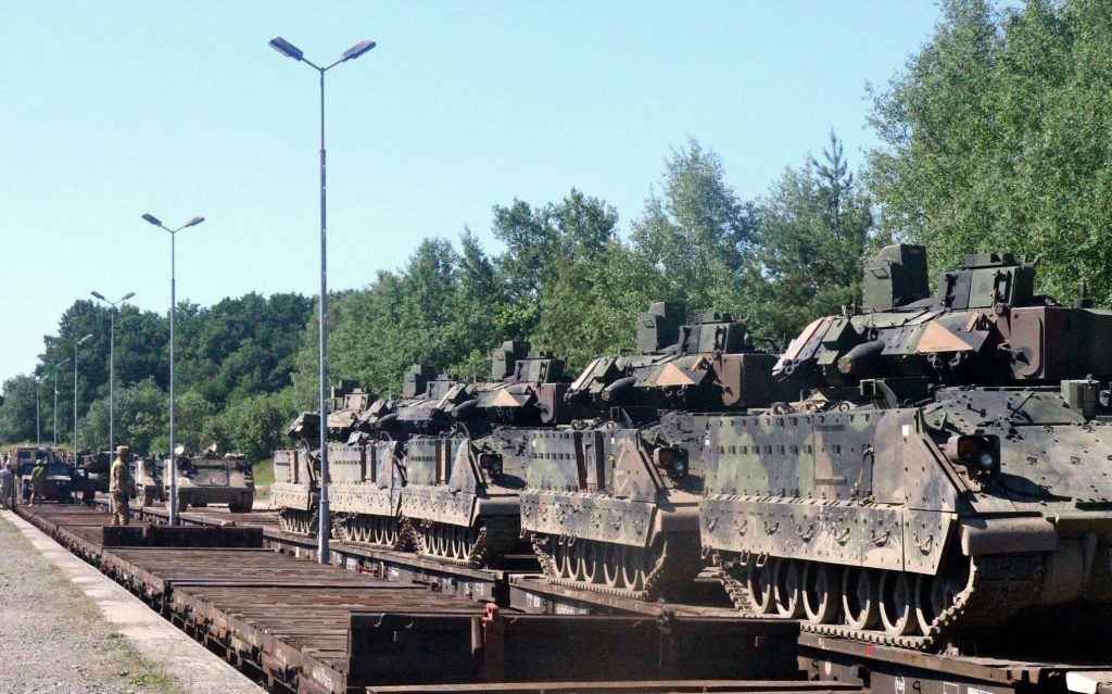 Soldiers from 3rd Battalion, 69th Armor Regiment load M2A3 Bradley Fighting Vehicles onto a train at Drawsko Pomorskie Training Area, Poland June 21. The heavily armored vehicles are being moved to the Baltics as the 1st Armored Brigade Combat Team, 3rd Infantry Division takes over the Operation Atlantic Resolve mission in Estonia, Latvia and Lithuania July 1 after previously taking over the mission in Poland May 1. (Photo by Staff Sgt. Syreetta Watts)