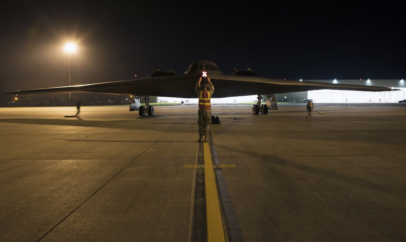 Airman 1st Class Austin Sawchuk, a crew chief assigned to the 509th Bomb Wing, marshals in a B-2 Spirit on the flight line at Royal Air Base Fairford, England, on August 27, 2019. 