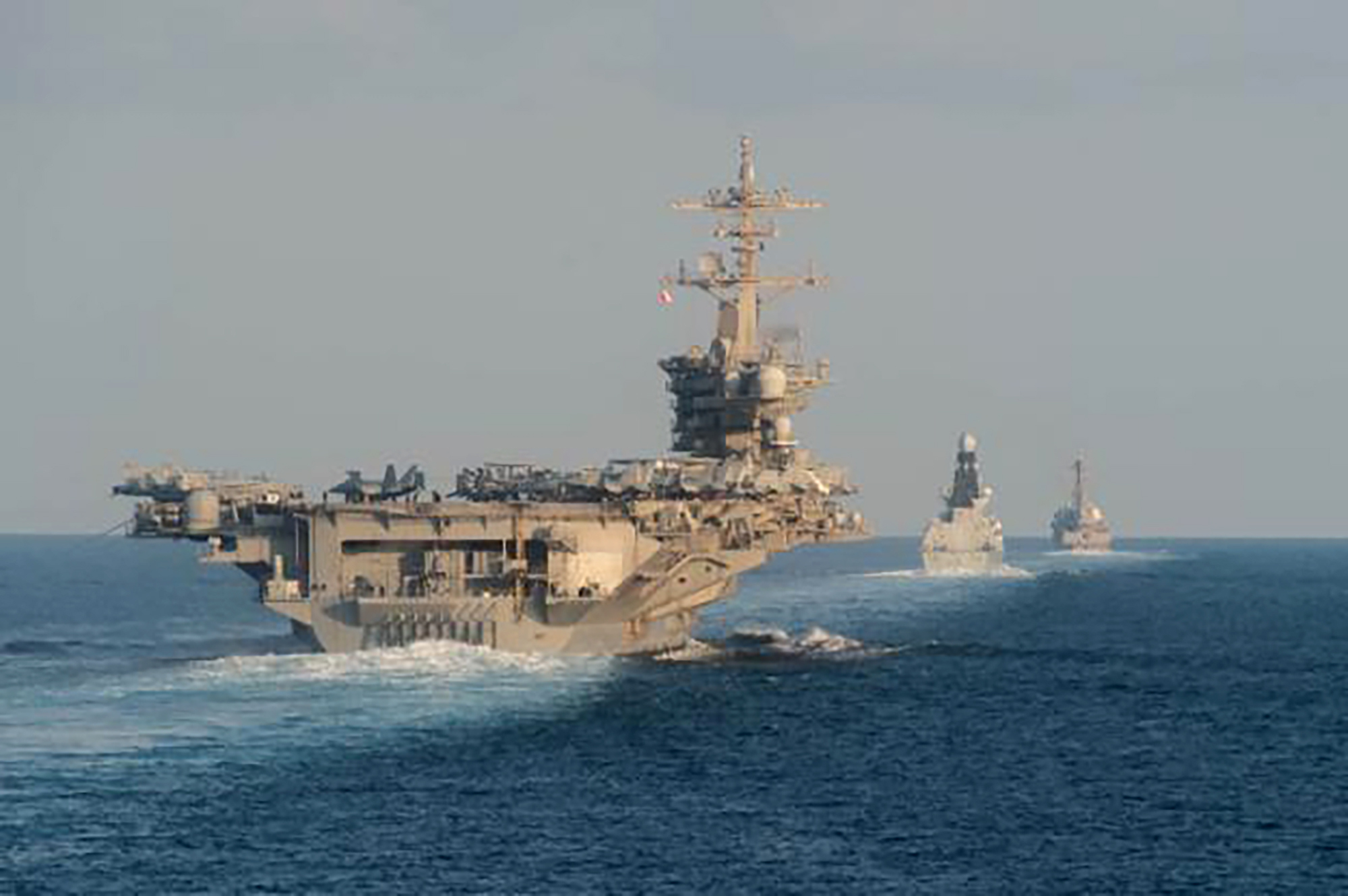 U.S. Navy aircraft carrier &#8216;harassed&#8217; by 20 Iranian small craft